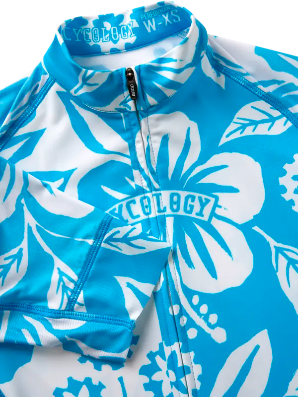 Women's Blue short sleeve cycling jersey with white floral pattern  with 'Cycology' branding.