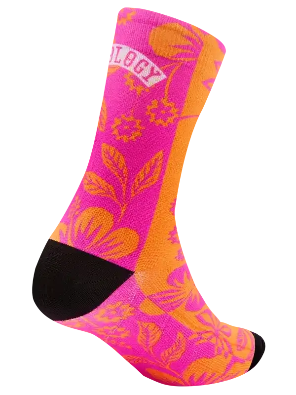 Vibrant pink and orange floral cycling sock with black toe and heel, featuring 'OLOGY' text detail