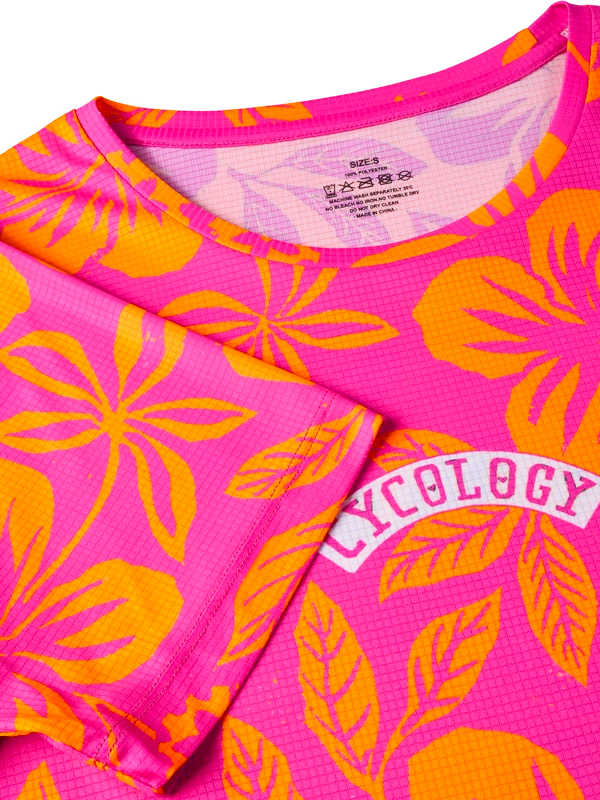 Women's Pink and orange floral patterned tech t shirt with 'Cycology' branding 