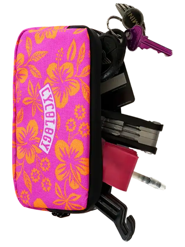 Oahu Cycling Wallet by Cycology Clothing with pink floral pattern and cycling tools.