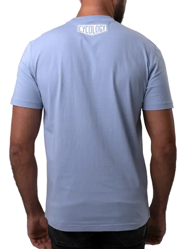 Light blue t-shirt with a Cycology logo on back design worn by a person