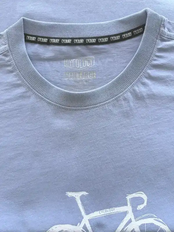 Light blue cycling t-shirt with white bike graphic and 'Cycology' branding on collar