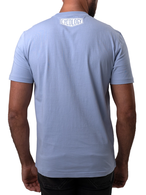 Light blue t-shirt with 'Cycology' logo on the back, worn by a person.
