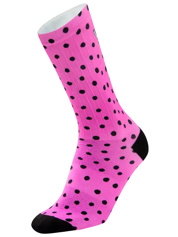 A single bright pink crew sock with a black polka dot pattern, black toe and heel, and a white ribbed cuff, shown on a plain white background.