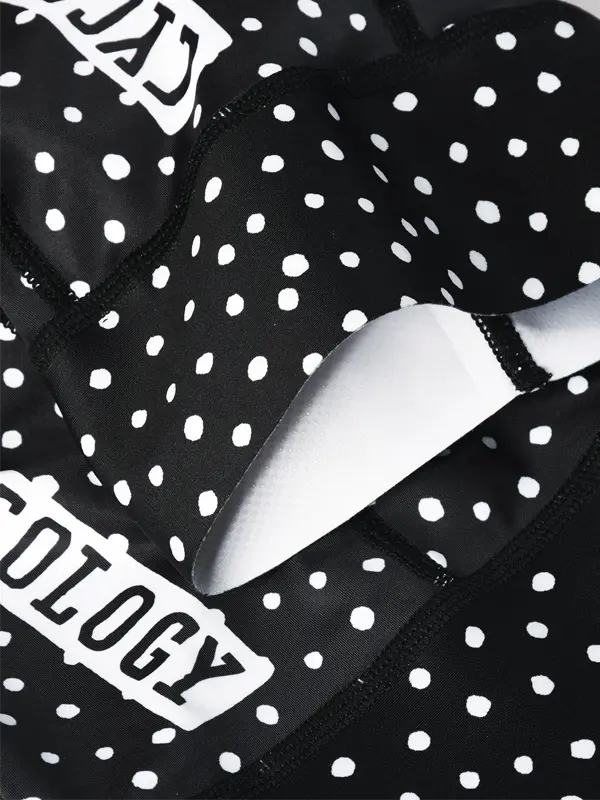 Black cycling bib shorts with white polka dot pattern - zip on back for quick stops-cuff