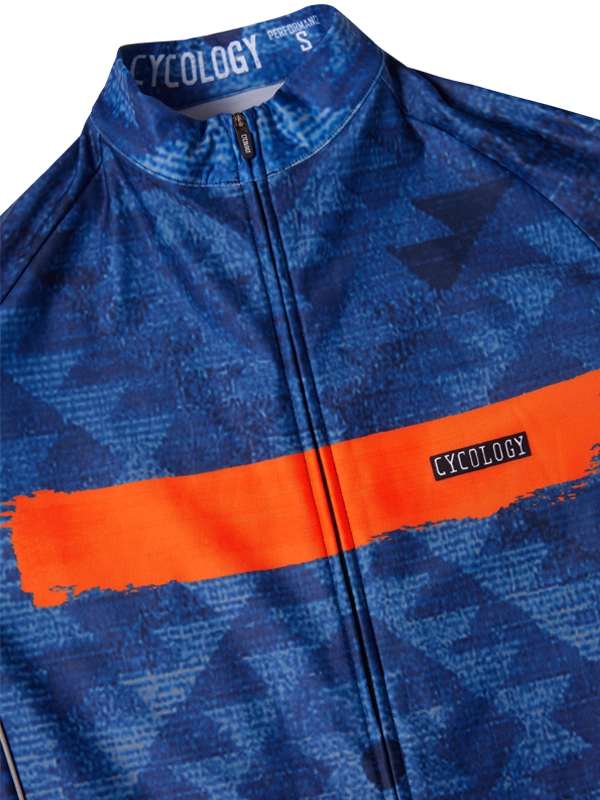 Blue long sleeve cycling jersey with orange stripe and logo across front 