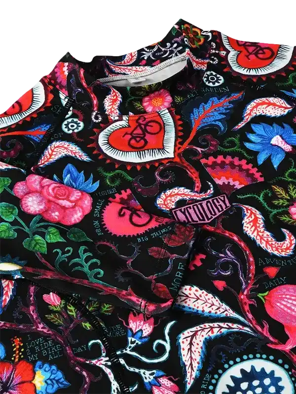 Vibrant floral cycling jersey with bold heart and bike designs, perfect for men's and women's rides.