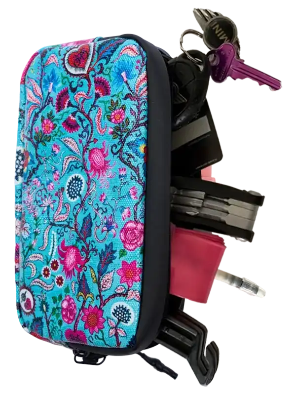Floral-patterned cycling accessory bag with keys and tools attached