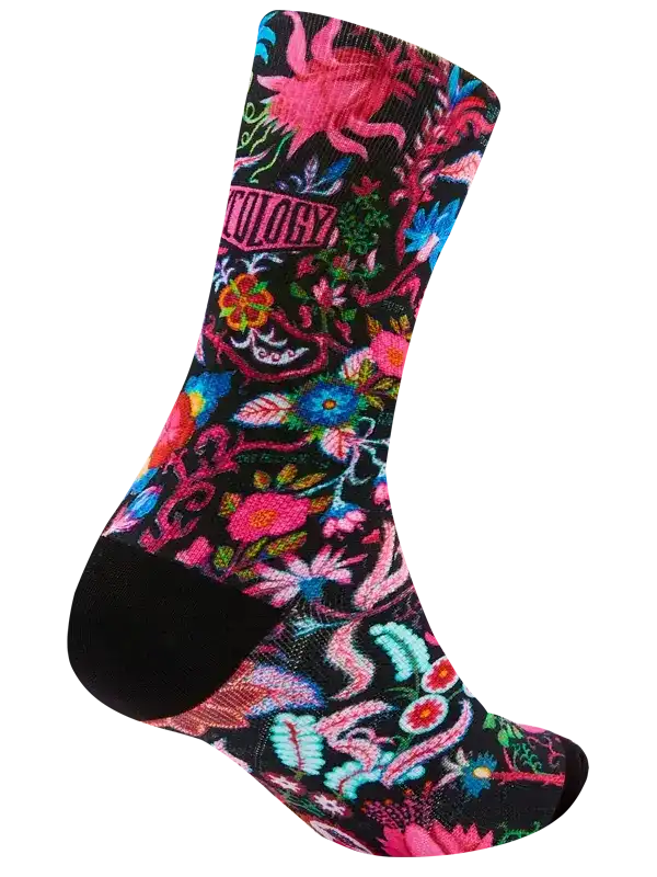 Colorful floral cycling socks with vibrant pink, blue, and green patterns on black background