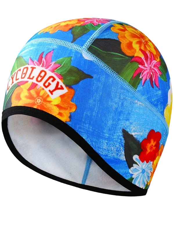 Colorful blue cycling beanie with floral design and Cycology branding 