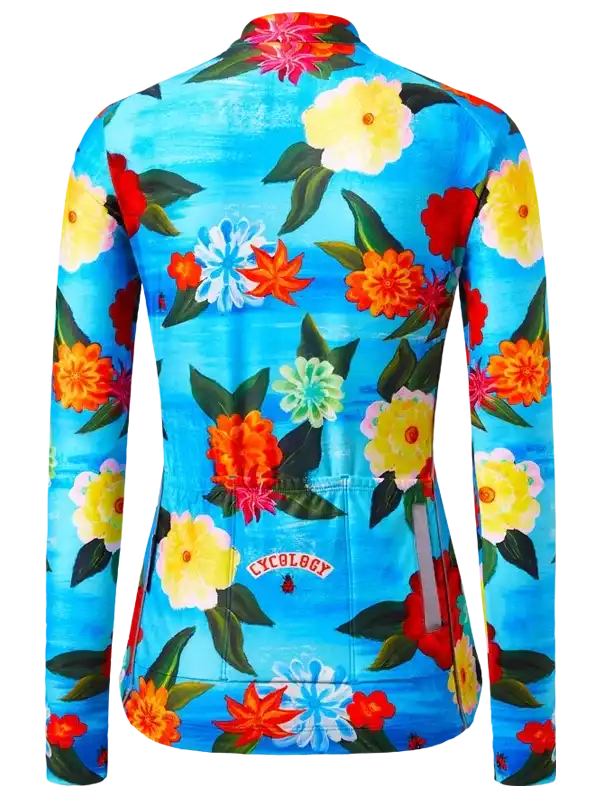 Women's cycling jersey with vibrant floral print on blue background, featuring rear pockets and reflective details