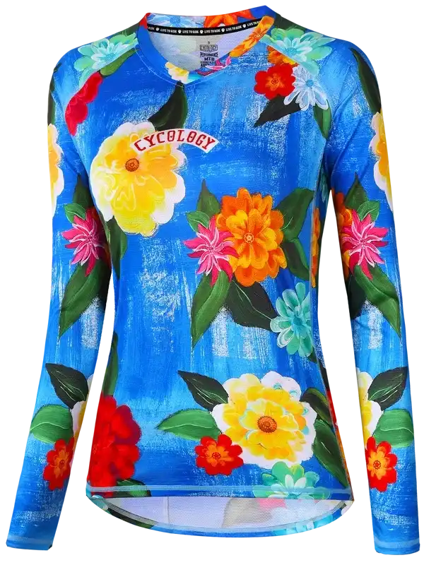 Women's floral cycling jersey with vibrant flowers on blue background, long sleeve bike wear