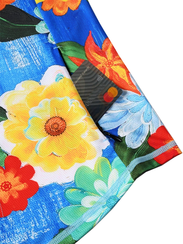 Close-up of a colorful floral fabric with vibrant flowers on a blue background with zip pocket 
