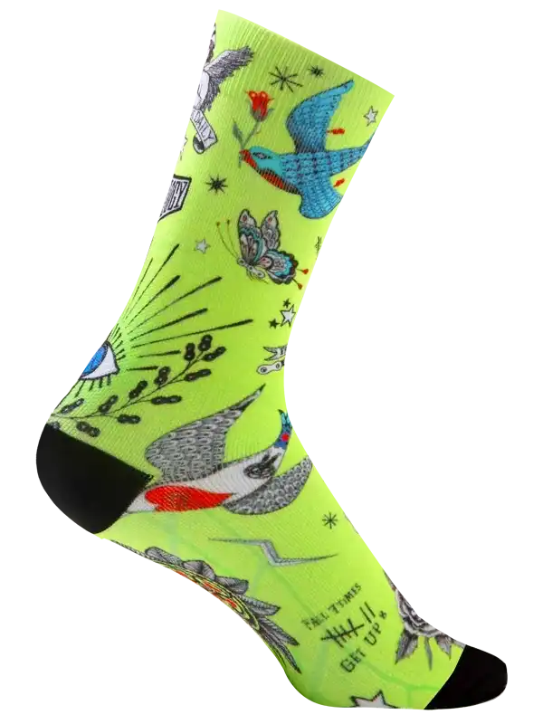 Neon green cycling socks with tattoo-style birds, butterflies, and stars for men and women