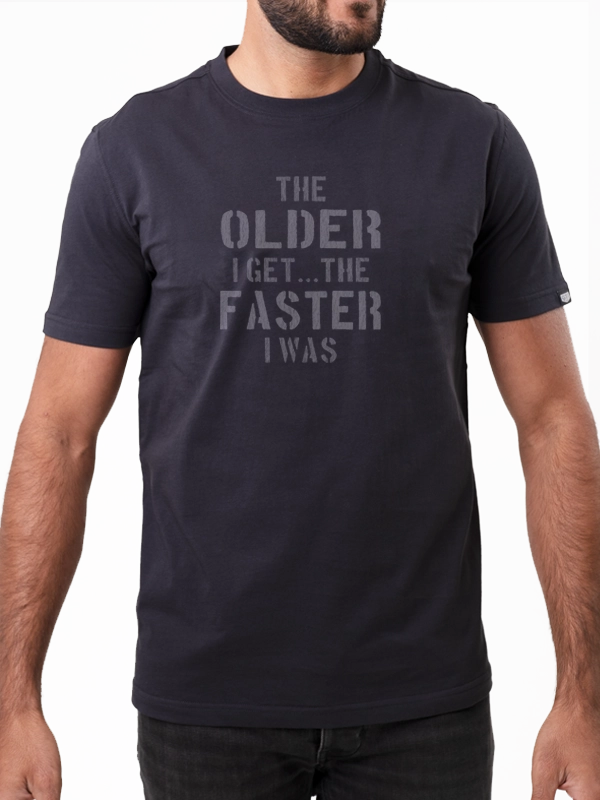 Black t-shirt with white text worn by a person on a white background