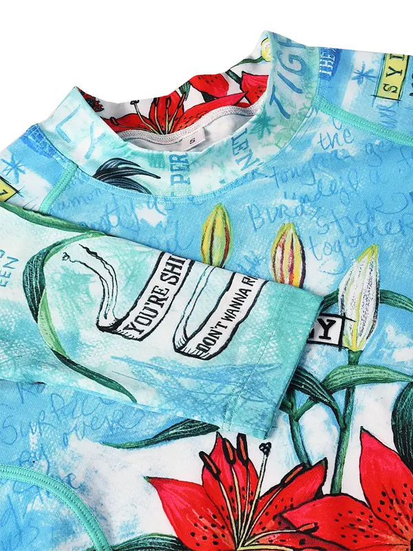 Cycling base layer with floral design and text on aqua background