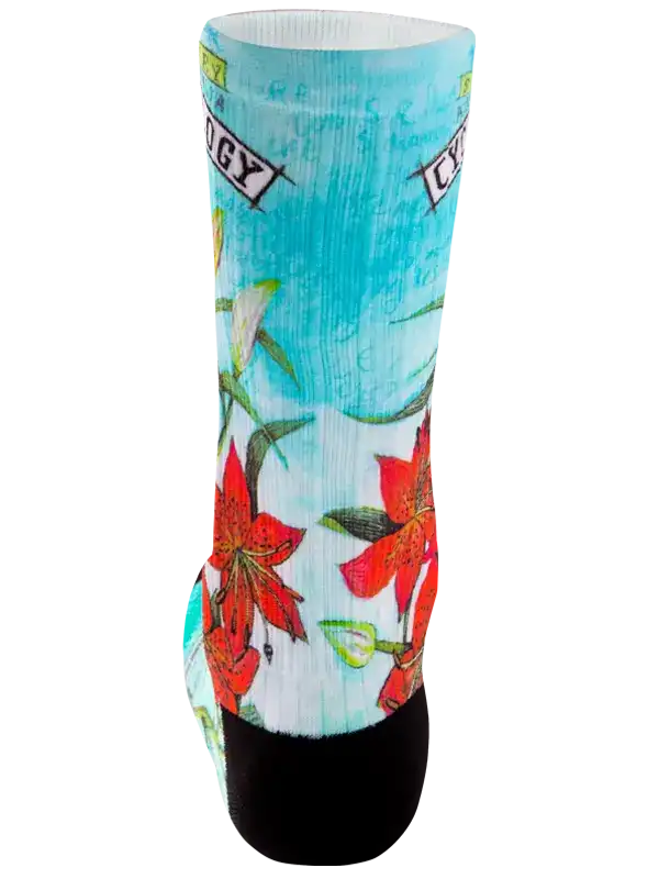 A single crew sock with a tropical print featuring red hibiscus flowers, green leaves, and a light blue background, finished with a solid black toe and heel.