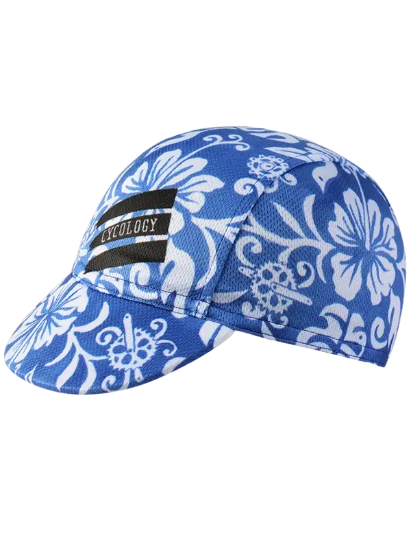 Blue floral cycling cap with white hibiscus pattern and black Cycology logo, designed for bike rides.