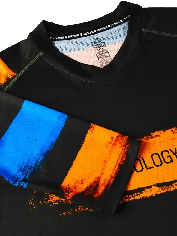 Black cycling jersey with bold blue and orange brushstroke design, ideal for MTB riders