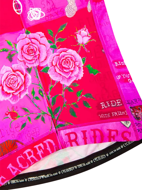 Pink and red fabric with floral designs and text 