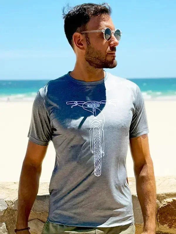 Men's cycling t-shirt with bike graphic, beach backdrop, lightweight fabric for active wear