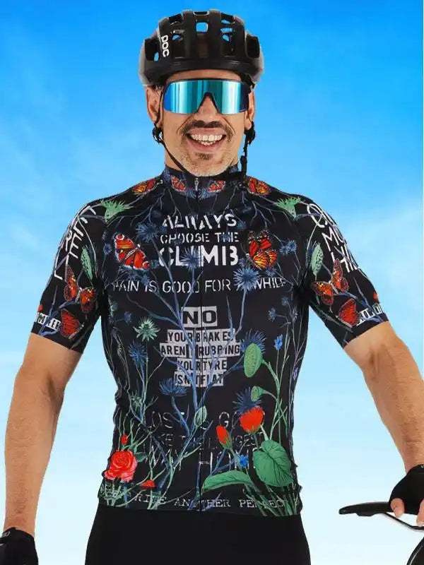 Men's cycling jersey with floral print and motivational text, worn with helmet and sunglasses