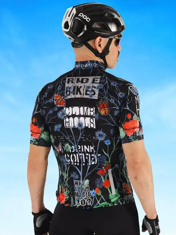 Men's cycling jersey with floral and butterfly print, bold text, worn with POC helmet and gloves