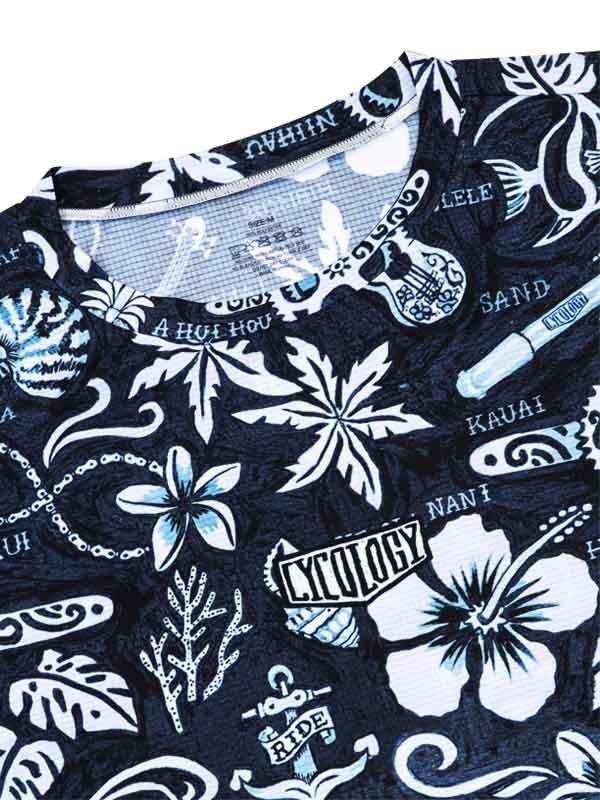 Black cycling jersey with white tropical floral and surf-inspired graphics, featuring 'RIDE' and 'Kauai' designs.