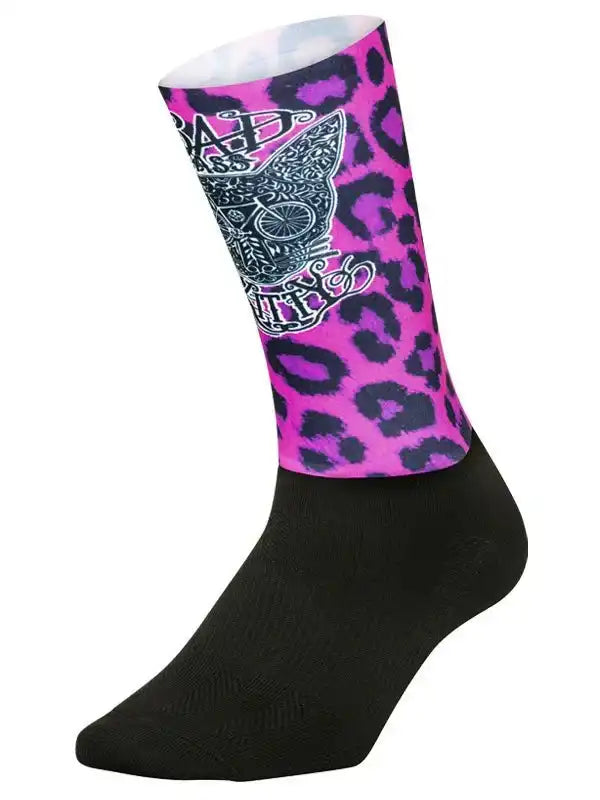 Pink leopard print cycling sock with skull and bike graphic, black foot, stylish ride gear