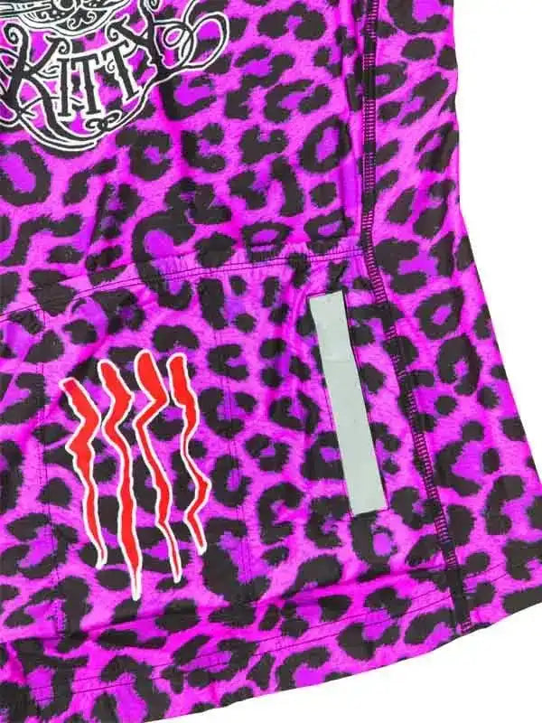 Vibrant pink leopard print cycling jersey with red claw design and reflective strip