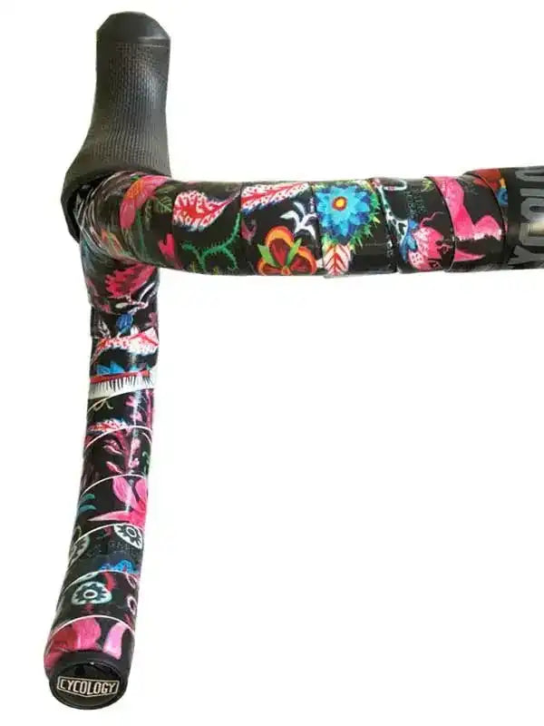 Colorful floral bike handlebar tape with black grip, featuring vibrant pink, blue, and green patterns for cycling comfort.