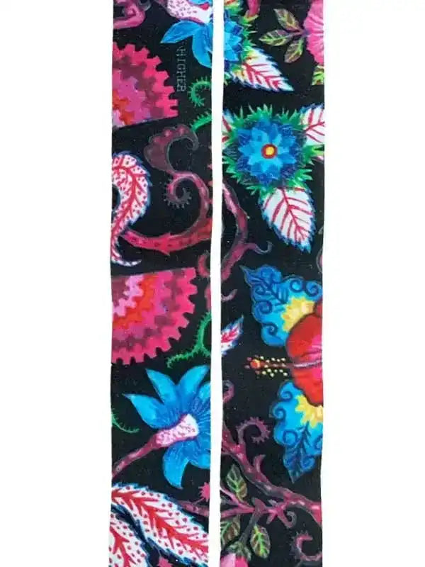 Vibrant floral cycling socks with bold pink, blue, and green patterns on black background