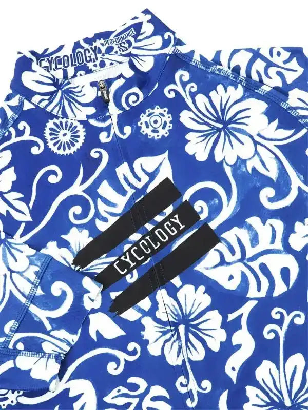 Blue and white floral cycling jersey with bold pattern and brand tag
