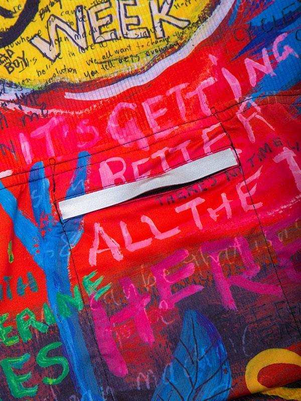 Vibrant cycling jersey with bold graffiti-style text and colorful designs for active riders