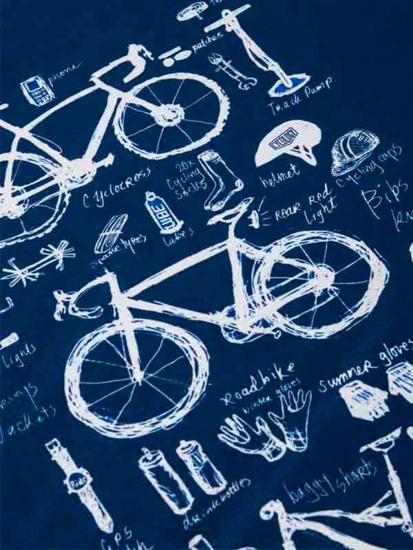 Blue cycling apparel fabric with white sketch-style bike and gear illustrations for men's and women's rides