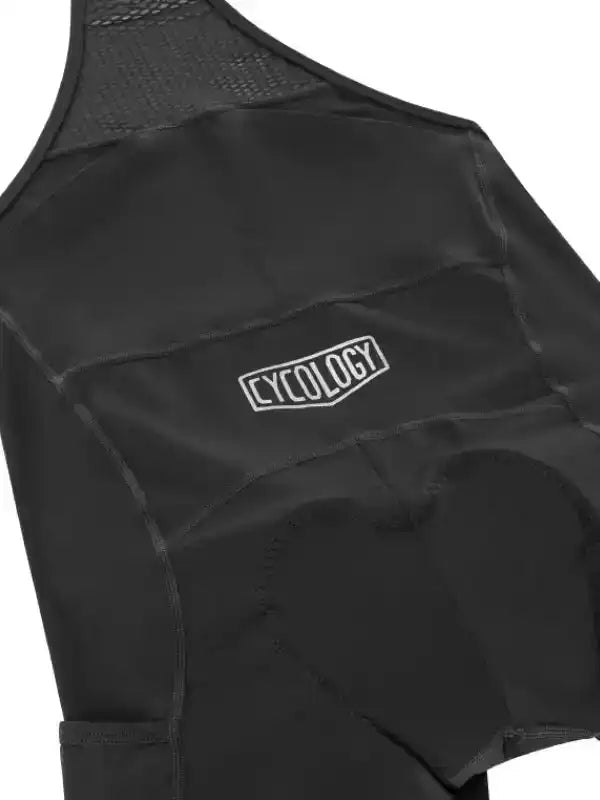 Black cycling bib shorts with padded seat and Cycology logo, designed for comfort and performance.