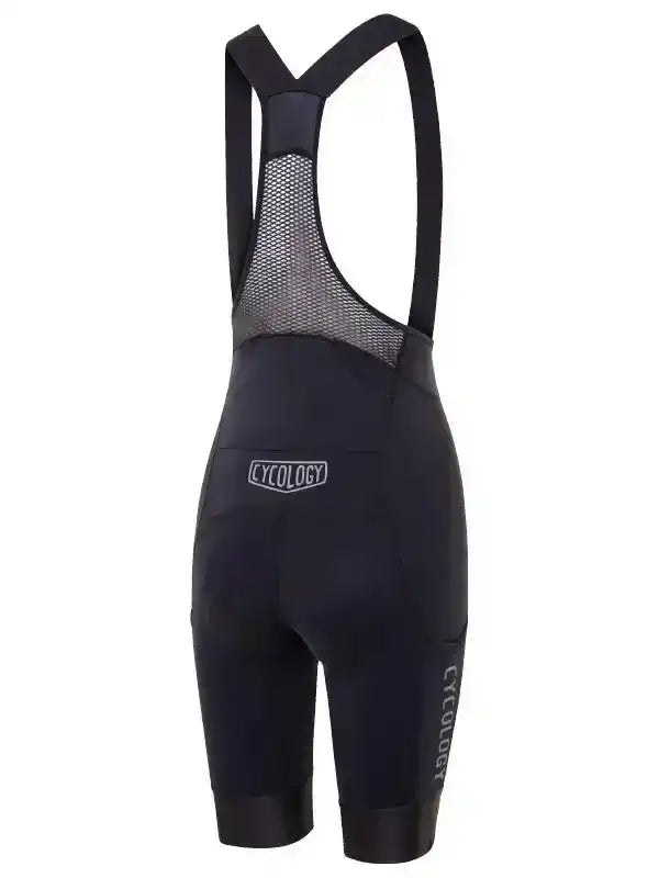 Black women's cycling bib shorts with mesh back panel and Cycology branding, designed for comfort and performance.
