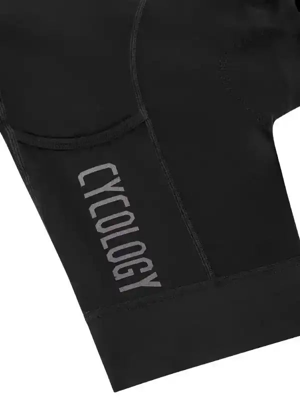 Black cycling shorts with 'Cycology' logo, featuring padded design for comfort during rides.