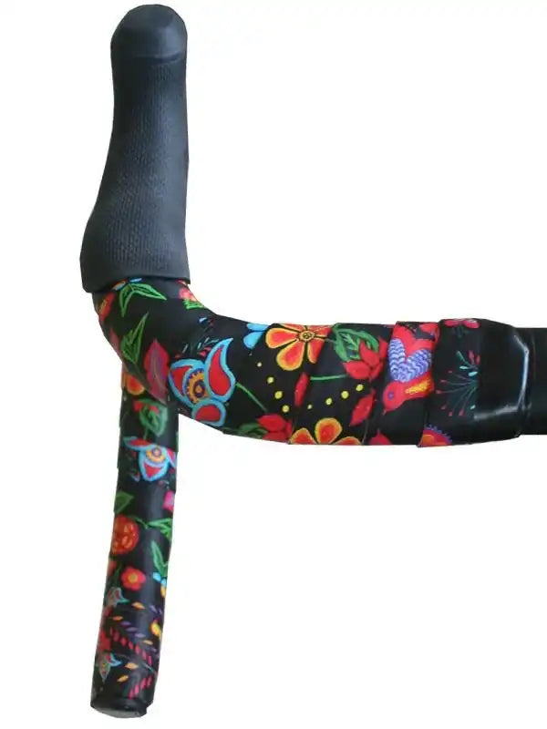 Colorful floral bike handlebar tape on black road bike grips, vibrant cycling accessory