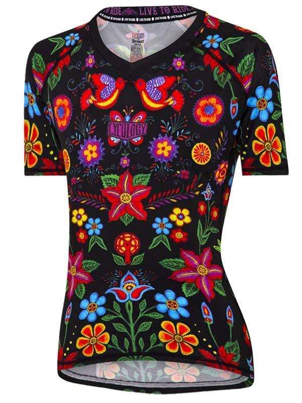 Women's cycling jersey with vibrant floral and bird print on black, short sleeve, performance fabric