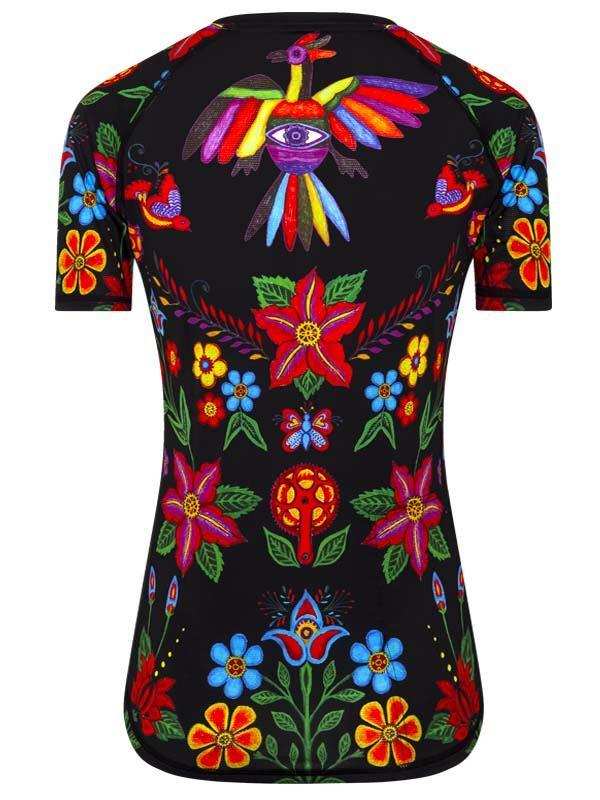 Women's cycling jersey with vibrant floral and bird print on black background, colorful design for bike rides
