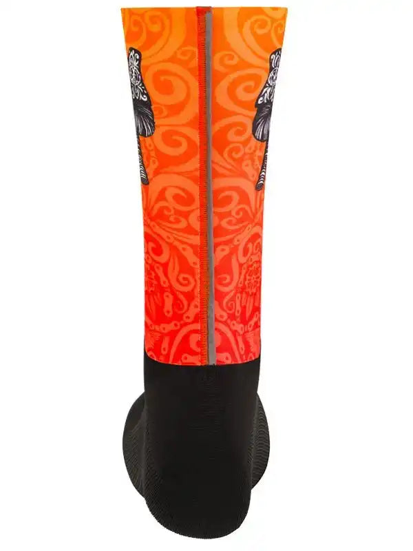 Orange cycling sock with swirl pattern and black toe, designed for men's and women's bike rides