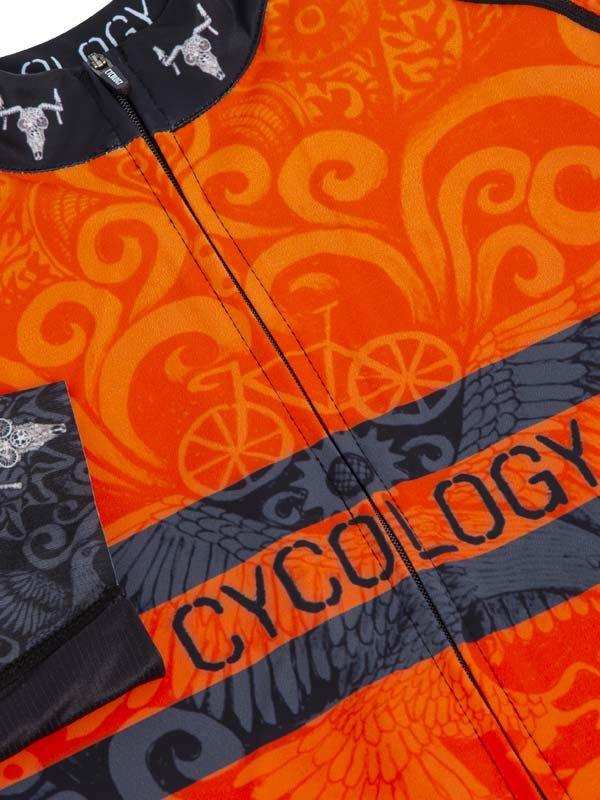 Vibrant orange cycling jersey with bold swirl patterns, wing motifs, and 'CYCOLOGY' branding for men's and women's rides.