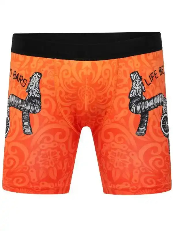 Orange cycling shorts with bike handlebar print and black waistband, men's cycling apparel