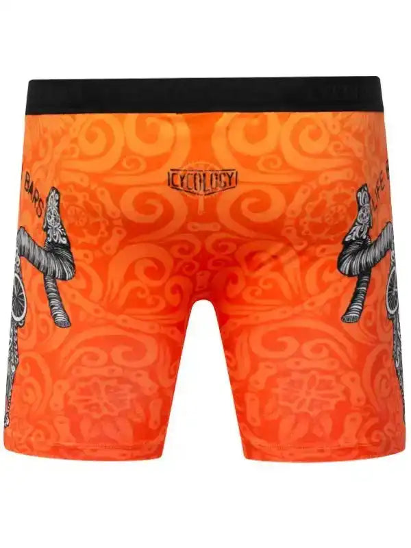 Orange cycling shorts with black waistband, swirl pattern, and bike graphic design for men