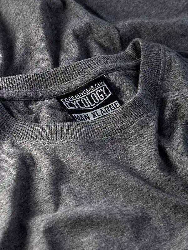 Grey men's cycling t-shirt with Cycology brand tag, size XL, soft fabric close-up