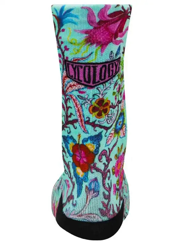 Colorful floral cycling sock with 'CYCOLOGY' logo, vibrant design for men's and women's bike rides