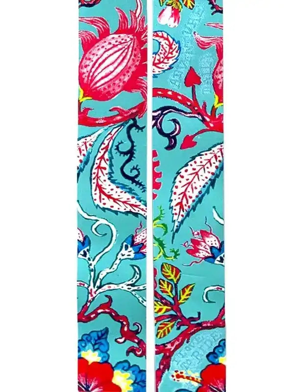 Vibrant floral cycling jersey fabric with bold red, blue, and teal botanical print for men's and women's bike wear