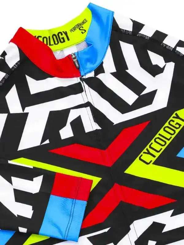 Men's cycling jersey with bold black, white, red, blue, and neon yellow geometric design