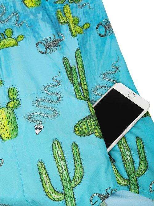 Blue cycling shorts with cactus and scorpion print, featuring phone pocket for on-the-go convenience.